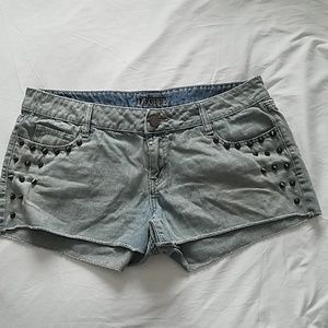 Green studded cut off shorts